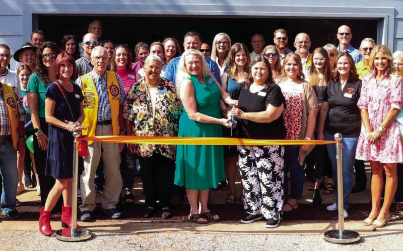 Several volunteers and vested community members turn out for the Payne County Youth Services ribbon cutting for the fitness center at the Emergency Youth Shelter.