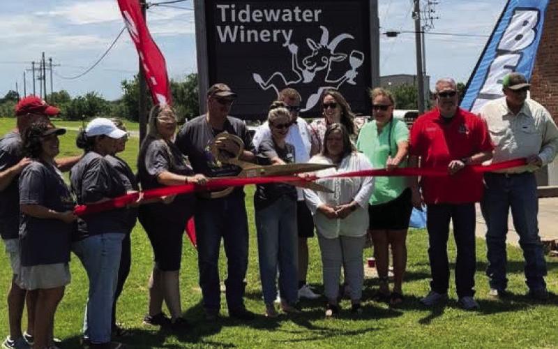 Tim and Lora Chambers cut the ribbon and ceremoniously open the doors to their new endeavour, historic Tidewater Winery.