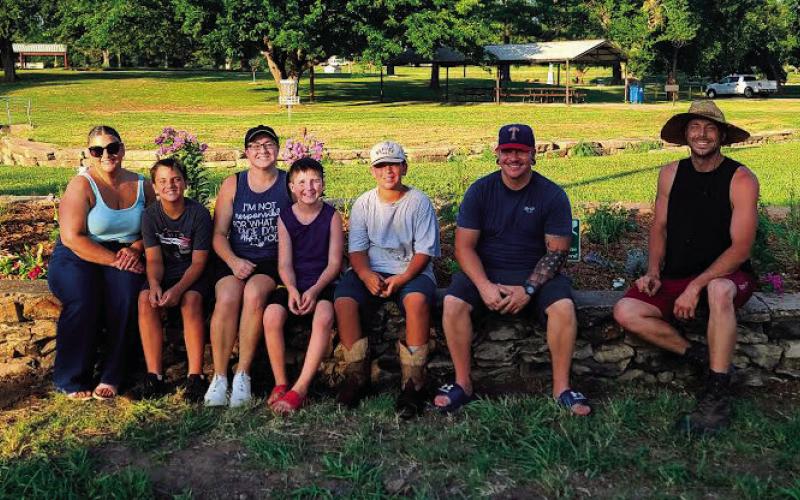 Local volunteers — Laurel Casteel, Adrian Casteel, Sara Bacon, Aidan Bacon, Jaxon Bell, Andre Casteel, and Derek Bell — all worked hard to get plants in the ground for Bell’s Keep Oklahoma Beautiful project.