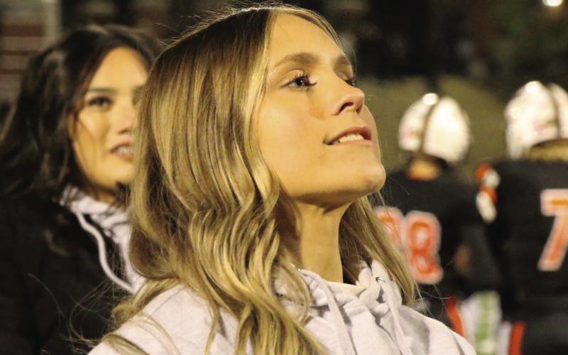 Cushing cheerleader Lauren Kimmel leads Tiger fans in the final game of the 2022 football season. Photo by Allie Prater