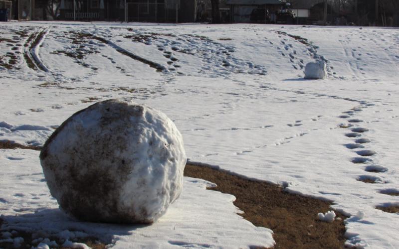 Time honored tradition of building snowmen