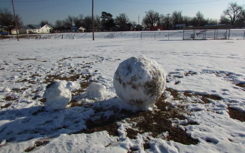 Time honored tradition of building snowmen