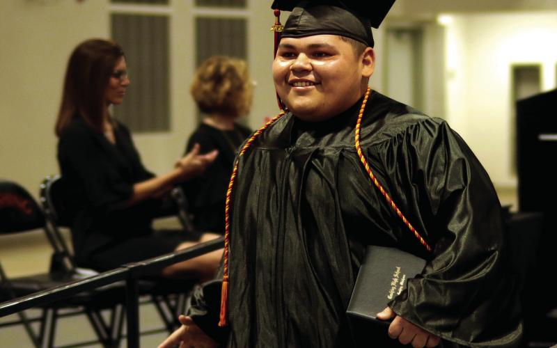 3. Nicolas “Panda” Flores beams after receiving his diploma.