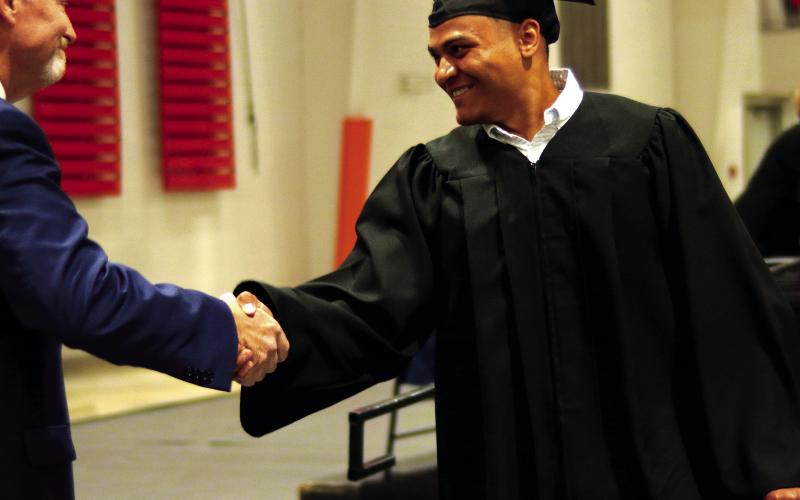 4. Xavier Wilson shakes hands with CHS Principal Bob Coats.
