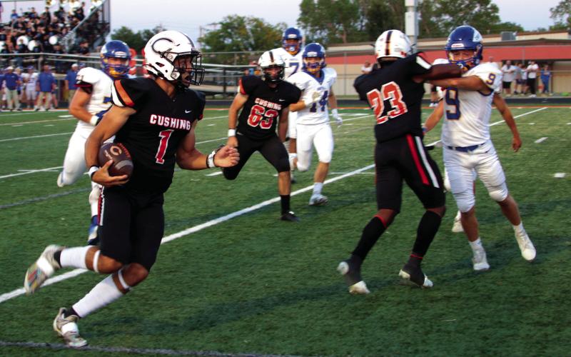 Tiger quarterback Blaze Berlowitz heads for the goal line on a Red Zone touchdown run.