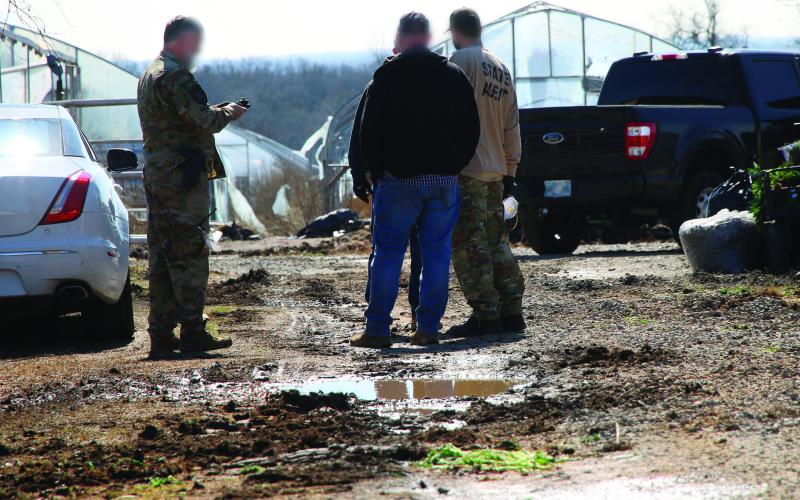 Oklahoma State Bureau of Narcotics agents working the crime scene during a raid of an illegal marijuana grow farm on SH-51 just west of Yale. Photo by Allie Prater.