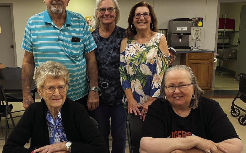 From left: Charles Beaver, Project H.E.A.R.T. Site Director Debbie Franklin, and SCC Director Debbie Brown stands behind Elma Fox and Catherine Johnson sitting.