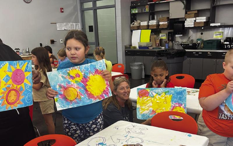 Participants of the Cushing Summer Art Camp show off their pastel suns. Photos courtesy Kathy Branyan