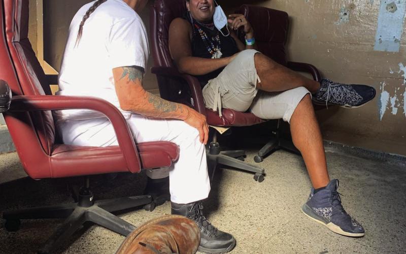 Cushing alumnus Dan Warrior, sits with Danny Trejo in the middle of the production of upcoming movie “Seven Cemeteries”. Warrior will play the role of a henchmen who throws a zombified Efren Ramirez into a wood chipper.