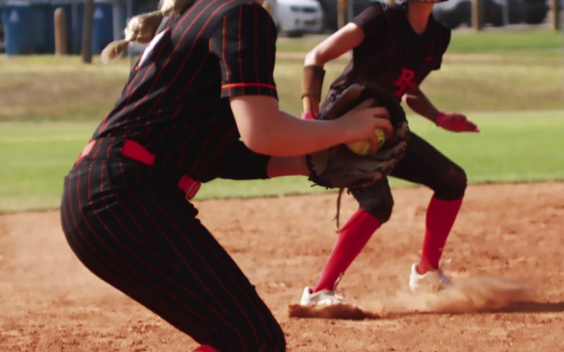 Peyton Lauderdale Holds off a Bishop Kelly runner at third. Photo by J. D. Meisner