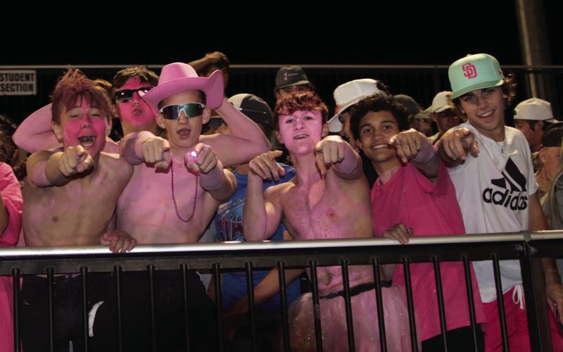Tiger fans Jagger Willing, Cole Vaughn, Clay McKiddy, Andy Collier, Daniel Hernandez, and Gage Lovin celebrate Cushing’s third touchdown of the night as the Tigers shut out Wagoner Friday during the Breast Cancer Awareness, pink-out game.