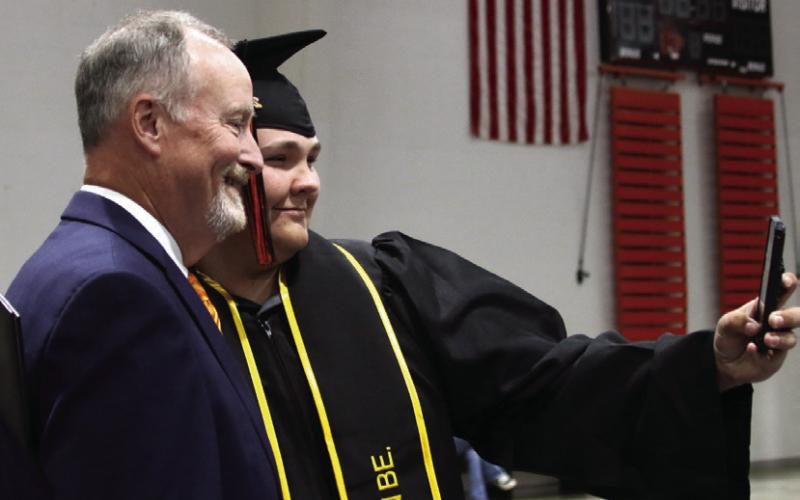 Landen Owen Meyers, who has enlisted the US Army, takes a selfie with Coates.