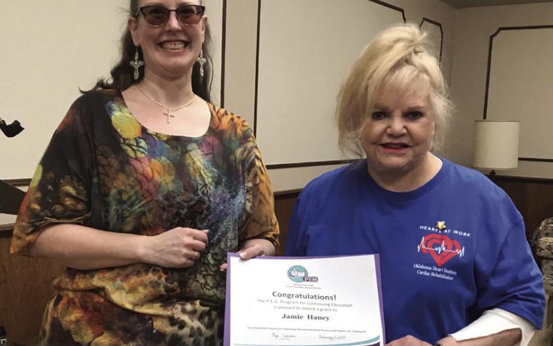 The Cushing Philanthropic Educational Organization (PEO) chairman Kay Turner presents a certificate for being the recipient of the PEO Program for Continuing Education to Cushing resident Jamie Haney. Photo courtesy Marylin Duff.