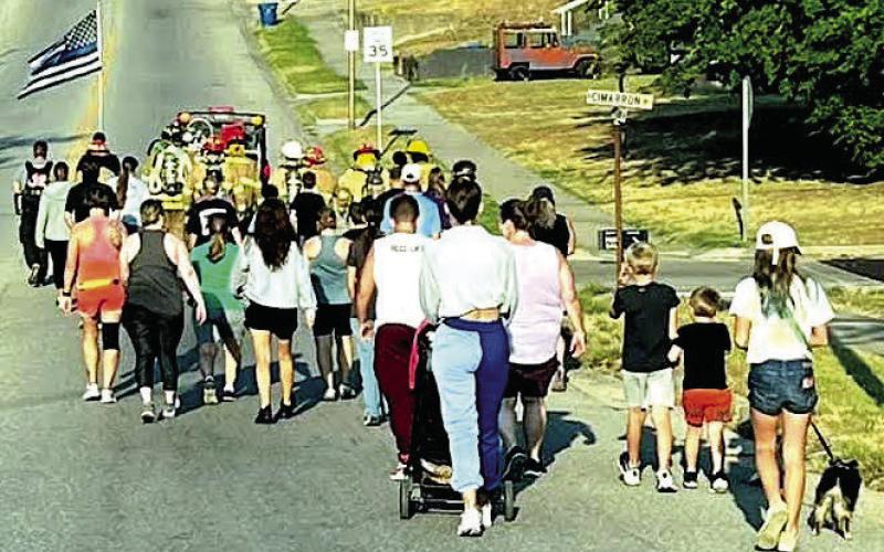 The 2024 Memorial Walk saw a fairly large turnout of community members with the Drumright Fire and Police leading the way down Broadway. Photo courtesy of Drumright Fire Department.