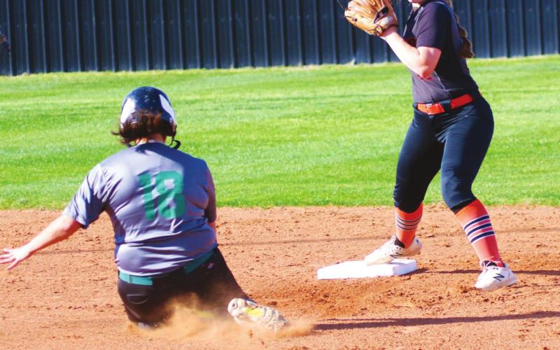 Right: Cushing Lady Tiger Rachel Sherwood turns a double play against the Seminole Lady Chieftains last week. The Lady Tigers defeated Seminole 14-2 in four innings.