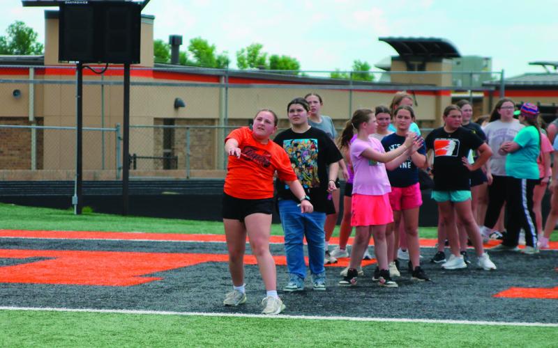 Fifth grade student Grace Lane tosses a softball onto the field during the Junior Olympics held last Friday on May 9 at O’Dell Field. Photos by DeAnna Maddox