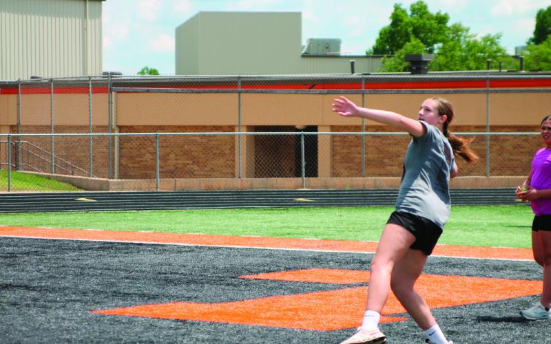 During the Junior Olympics sixth grade student Rylan Christenson tries to put some power into throwing a softball for one of the events.