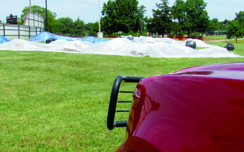 Once the shells and shot boxes were fully set up the Cushing Fire Department covered them with a tarp, set up a perimeter, and kept a department member on site to keep a watchful eye on the equipment. Photo by DeAnna Maddox