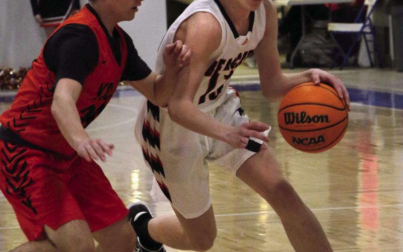 Agra Bearcat Landon Toles drives past a Yale defender during the Bearcats game against the Bulldogs at the Glencoe “Coaches vs Cancer” Tournament this past weekend. Photo by Allie Prater