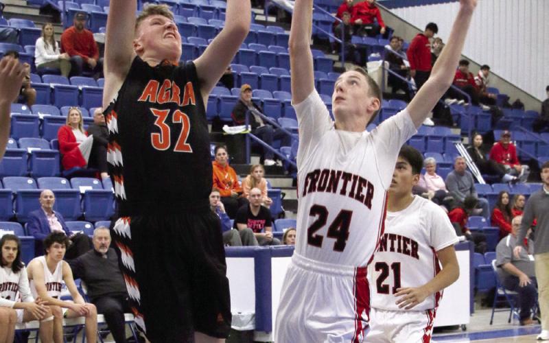 Bearcat Trey Poteet goes up for a deuce against a Mustang guard during the Agra vs Frontier game at the Glencoe “Coaches vs Cancer” Tournament this past weekend. Photo by Allie Prater