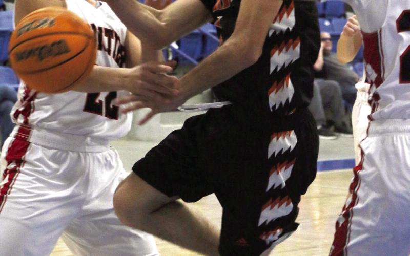 Bearcat Titus Rodgers draws a foul (or two) as he drives to the basket during the Agra vs Frontier game at the Glencoe “Coaches vs Cancer” Tournament this past weekend. Photo by Allie Prater