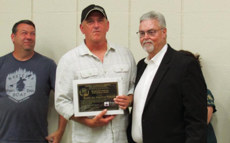 Pictured is Jerry Mack with Plains All American Pipeline accepting a Patriotism through Partnership award from Cushing Celebrates America organizer Mike Kennedy.