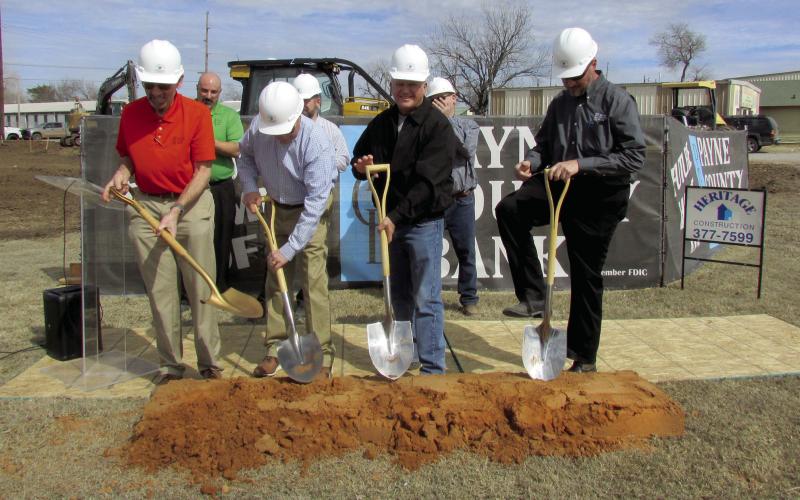 A groundbreaking ceremony for Payne County Bank’s upcoming Cushing location was held on Feb. 24. The anticipated opening date for the new business is Sept. 1 and will offer Saturday banking services. Lynn Kinder explained the bank will be 100 percent employee owned; he said, “It will not only be located in the community but will be a part of the community”. Pictured from left are Kinder, Heritage Construction Co. Contractor Dusty Lane, Richard Rogers, and Chris Peterman. Photo by DeAnna Maddox