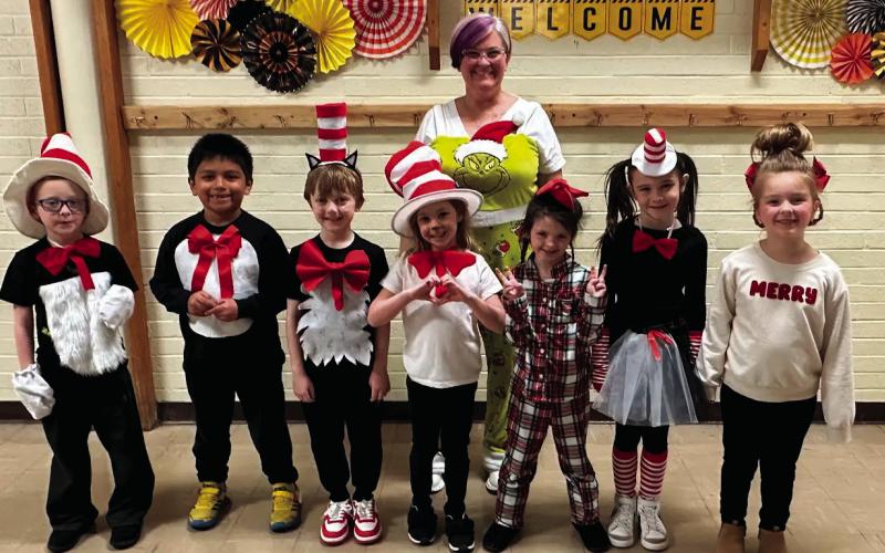 Kindergarten students Cecil Penny, Benjamin Garrido, Tripp Grigg, Livia Hatfield, Finley Hagen, Jensyn Myers, and Kinley Spargo with their teacher Destiny Vaughan, all participated in Dress as your Favorite Suess Character Day.