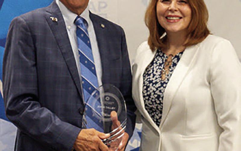 Right: Rep. John Talley, R-Stillwater, receives the Outstanding Elected Official Award from Lorri Essary, director of the Family Support and Prevention Service at Oklahoma State Department of Health.