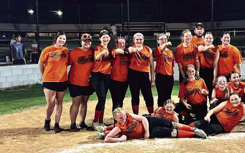 The 12U Cushing Lady Tigers won the Lincoln county league championships in a four-team playoff in Davenport last Tuesday. The team finished the season with a record of 10-2. They are, front row from left, Tyler Leverich, Avery Richardson, Arhyanna Tusler, Grace Lane, Teagan Williams and Rylan Christensen. Back row from left, Coach Haydan Marshall, Coach Laura Green, Harper Jones, Vaeda Nugent, Logan Marshall, Gemma Lane, Willow Peaslee, Coach Dusty Nugent, Ashlynn Stevens and Coach Michelle Nugent.