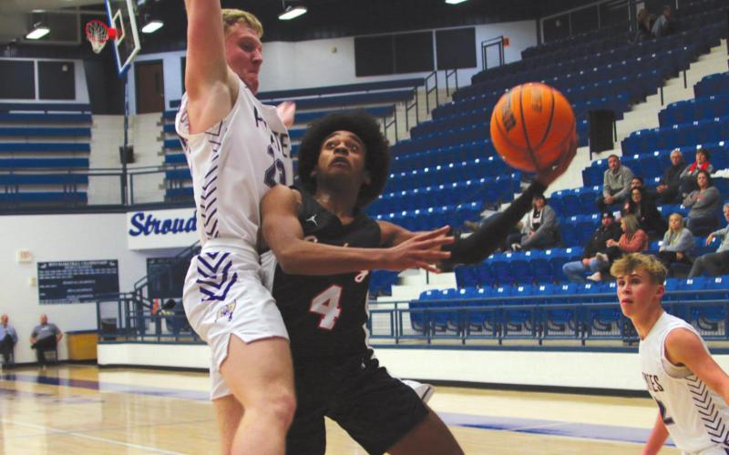 Above: Trevin Ezell puts up a shot in traffic.