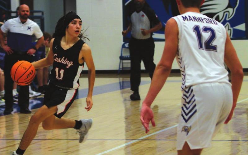 Left: Kanaan Guerrero sets up the Cushing off ense. Photos by J. D. Meisner