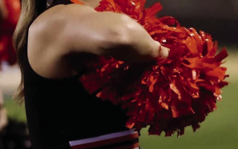 Senior Tiger cheerleader Emery Turner hypes up the crowd during the Friday’s thrashing of Oologah. Photo by Sylvia Danyele
