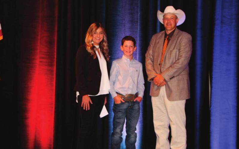 Outgoing OJCA President, Sarah Armitage (left) and Mike Weeks, OCA President (right) pictured with Kelton Arthur, 2020 OJCA All-Around Junior Cattleman of the Year.