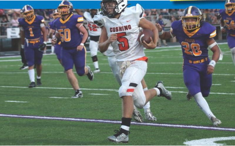 Tiger quarterback John Hilligos sprints down the sidelines on his way to a 38-yard touchdown against a scrappy Bristow team. Hilligos threw for a total of 205 yards and had 50-yards on eight carries. The Tigers defeated the Pirates 34-21 and will face Perkins at home this Friday at 7 p.m. Photo by J.D. Meisner.