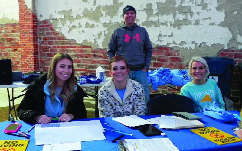 Sign in team, from left, Lexi Covalt, Malayna Hasmanis and Laighton Payne
