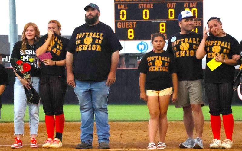 Emotions overcome CHS senior softball players Gracyn Presley and Faith Kesler as they stand on the infield with their families during senior night recognition last week. Photo by Sylvia Danyele
