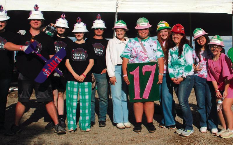 Cushing High School aeronautics Team 17 and Team 18 members stand with their instructor Dr. Jessica Sigle at Speedfest XV in Stillwater.