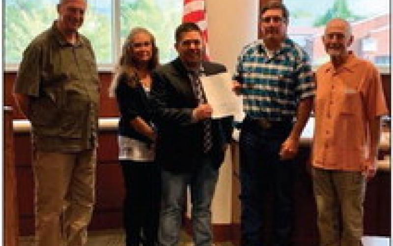 Love INC.: Pictured left to right – Commissioner Chris Reding, D2; Commissioner Rhonda Markum, D3; James Austin, Executive Director Love INC.; Commissioner Zach Cavett, D1 and Chairman; Love INC. Board Member Gary Detrich.