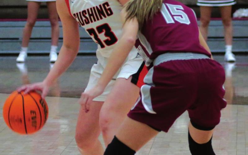 Kelly McBroom begins the hunt for a seam in the Muldrow defense. Photos by J.D. Meisner
