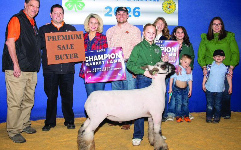 Emmy Annuschat of Heritage 4-H poses with her natural market lamb. Annuschat earned Champion honors in Natural Market Lamb Class 3 and also placed first in Crossbred Market Lamb Class 7, earning a Bronze Medallion. Photo by Meagan Stephens.
