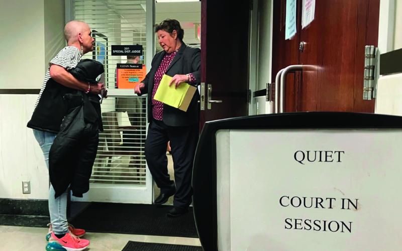 Virginia Banks is shown during an encounter with an unidentified person at the Payne County courthouse. Photo by Elizabeth Caldwell, Oklahoma Watch