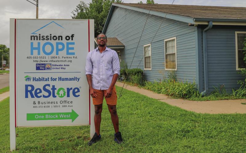Gipson stands outside the Mission of Hope organization that once helped him so fully and that is now facing a funding crisis and asking for community support to stay operational.