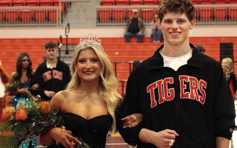Cushing 2023 Wrestling Homecoming Queen Kinzie Smith and King Kaiser Simpson smile at the crowd after coronation Thursday, Jan. 12. Photos by J.D. Meisner