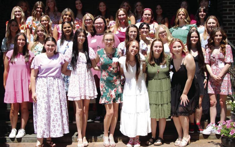 CHS senior girls enjoy the warm weather Monday, April 29, at the Senior Tea fashion show hosted by the Geographic Club of Cushing. Photo by Allie Prater