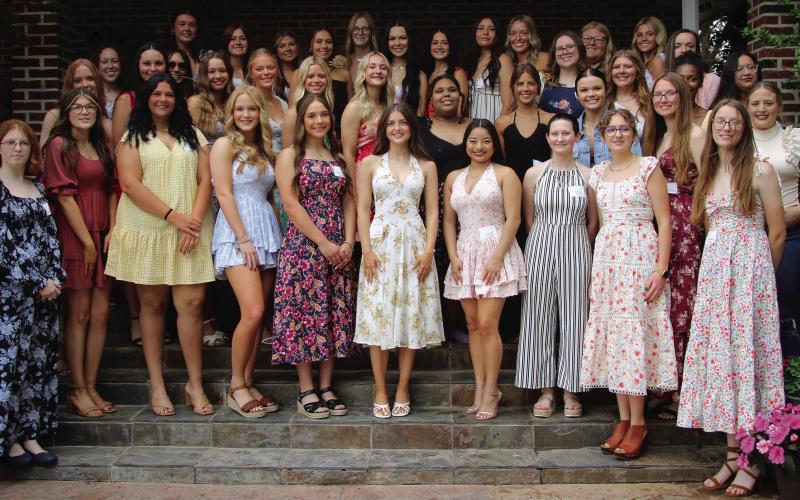The young women of the class of 2025 gather on the steps of Betsy Hibbard’s home Monday, April 28, during the 105th annual Cushing Geographic Club Senior Tea. See more photos on page 9. Photo by Allie Prater.