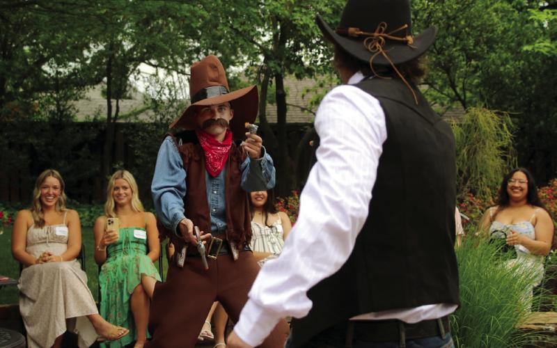“The Cowboys” Tommy Rolfe and Sam Moyer get into a quick draw contest on the runway.