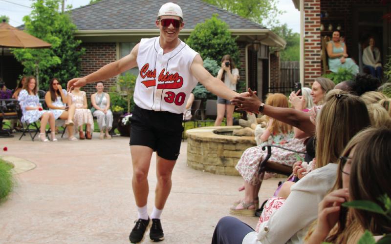 “The Jock” Wyatt DeLong greets his “fans” along the runway.
