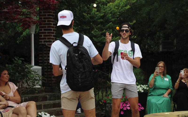 “Frat Rats” Lane and Max Wood play cup pong on the runway.
