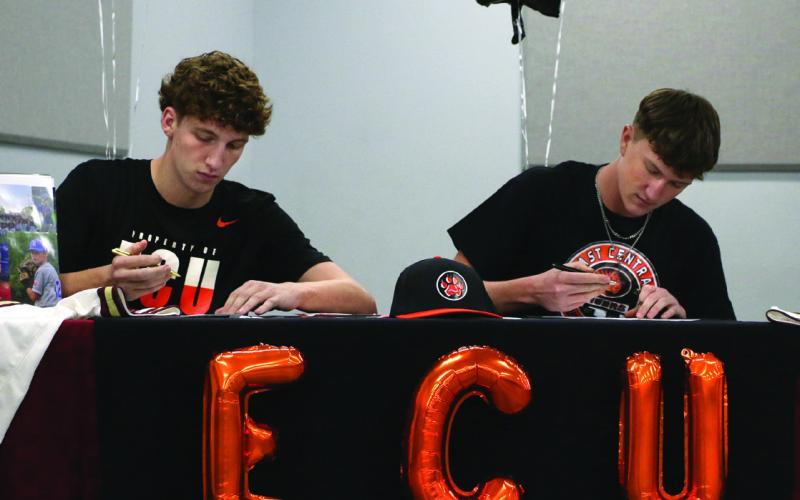 Ripley Warrior baseball players Beau Burch and Caden Hood sign their letters of intent to play baseball for East Central University in Ada, Thursday, Nov. 9.